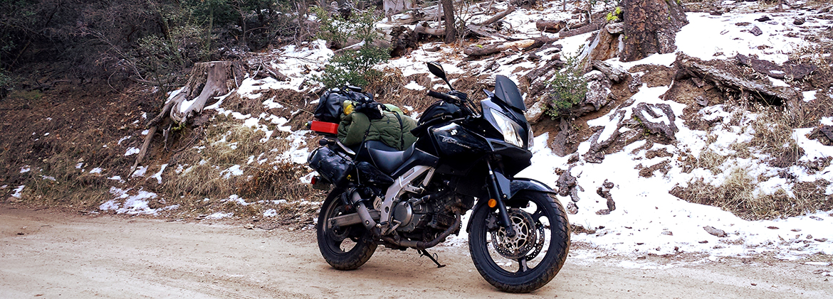 Susuki Vstrom 650 in full ADV mode with side/rear racks, Wolfman bags, Rotopax, and Rok Straps PMRacks PMR